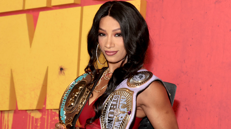 Mercedes Mone holding the TBS and NJPW STRONG Women's Championships