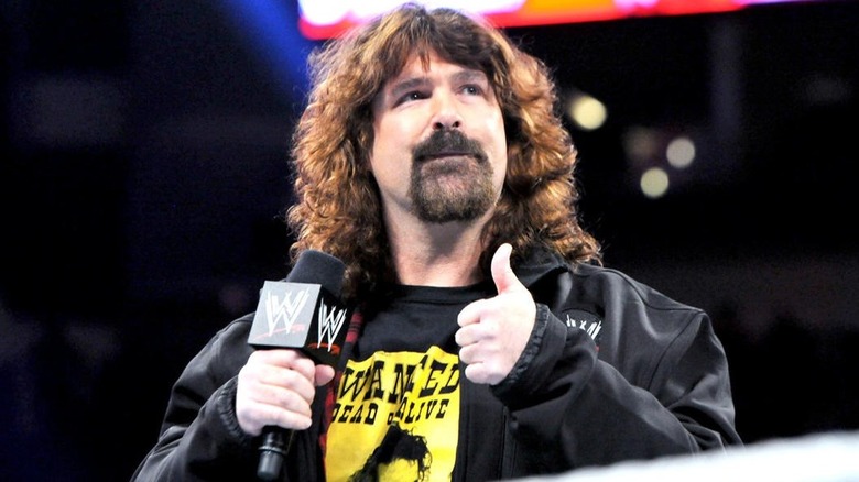 Mick Foley with his thumbs up pose