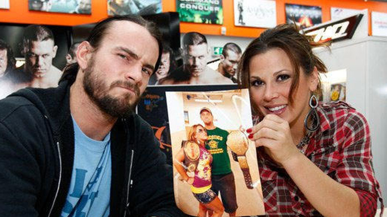 CM Punk and Mickie James at a past WWE signing event