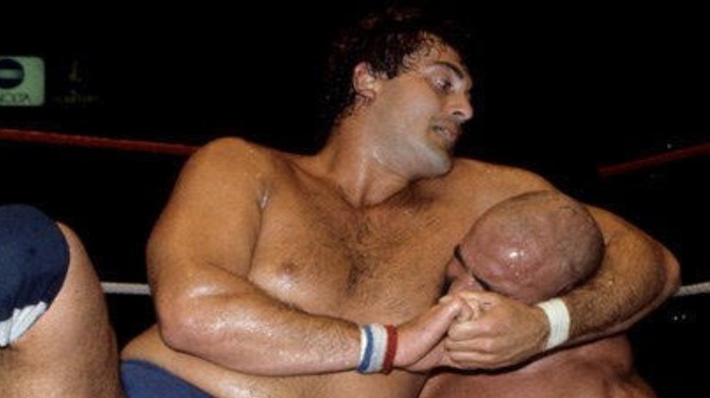 Mike Rotunda grounds an opponent