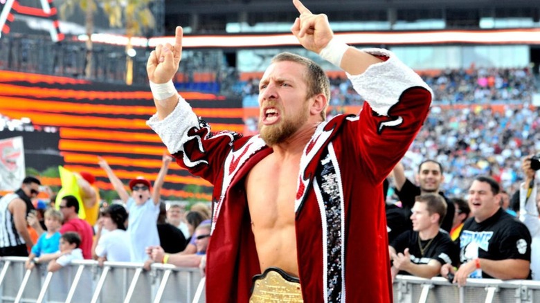 Daniel Bryan hits his "Yes!" pose walking down the ramp, wearing the World Heavyweight Championship, before his match with Sheamus at WrestleMania.