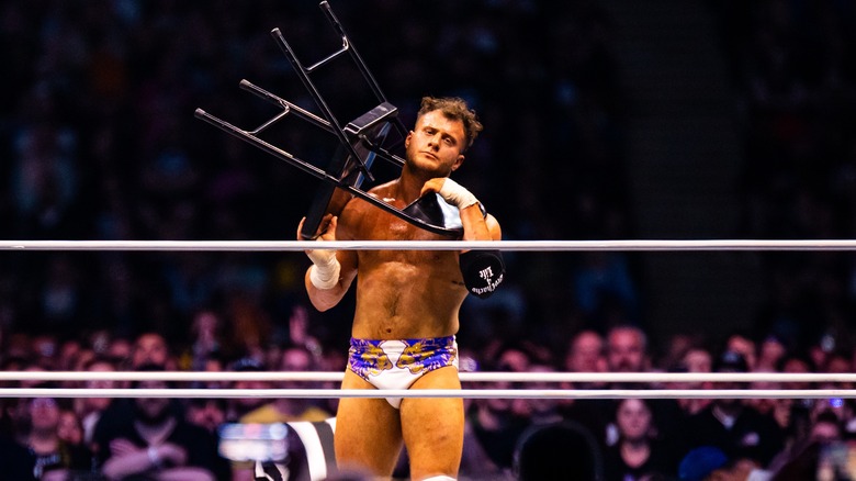 MJF with a chair around his own neck