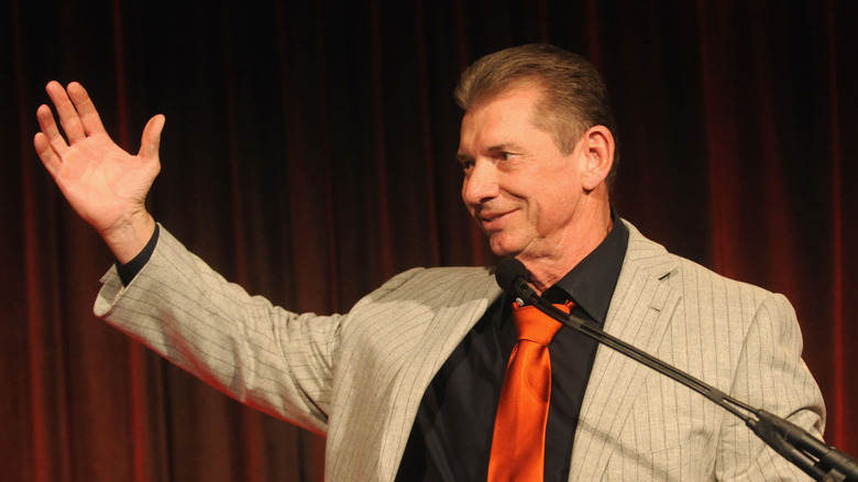 Vince McMahon with arm extended