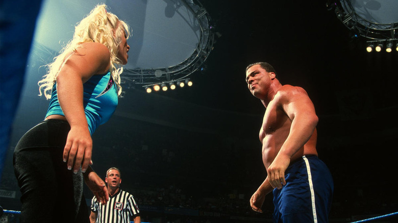 Molly Holly and Kurt Angle facing off