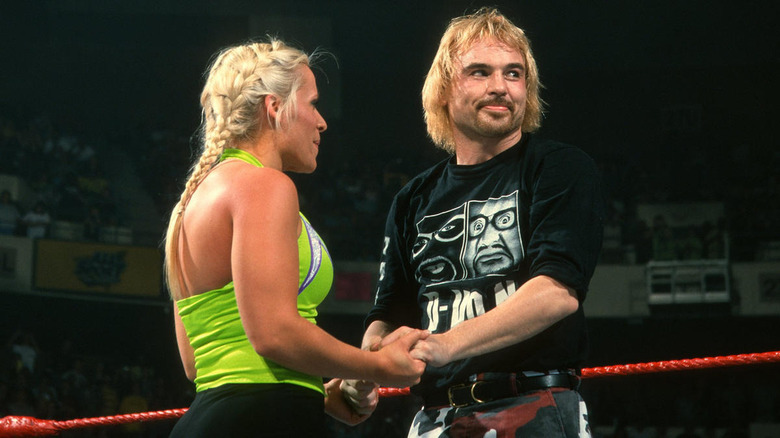 Molly Holly and Spike Dudley holding hands