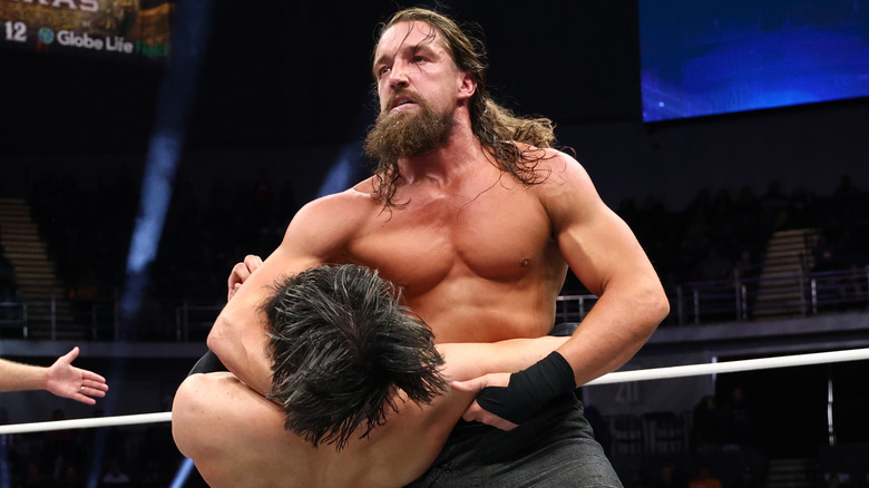 Jay White holds Wheeler Yuta up for a move during a match on AEW programming.