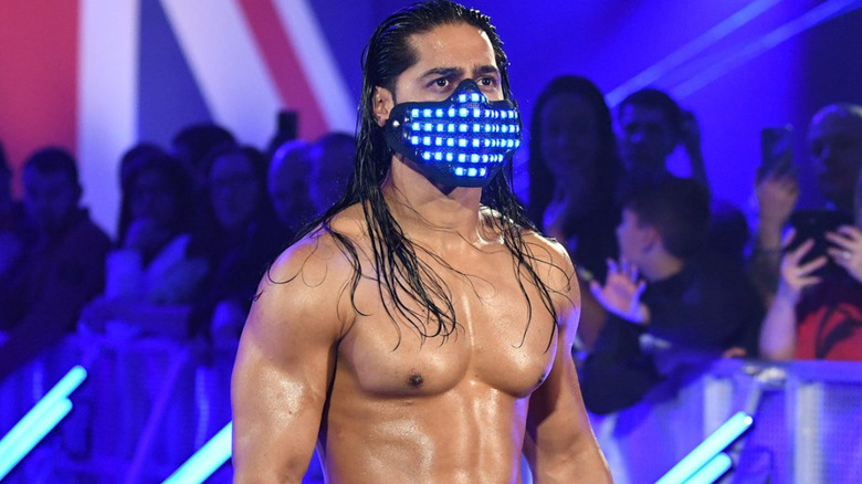 Mustafa Ali wearing a blue light up mask