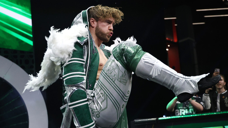 Will Ospreay motions to stomp on the ramp while heading down to the ring for a match on 