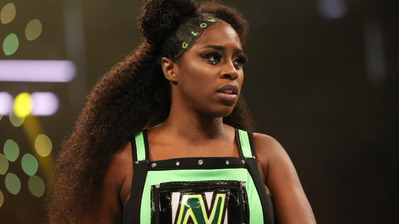 Naomi wearing green and black ring gear