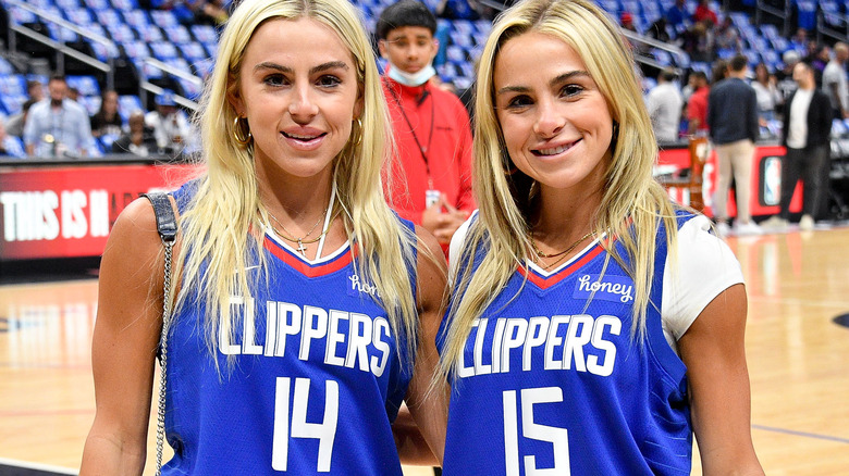 The Cavinder twins wearing Clippers jerseys