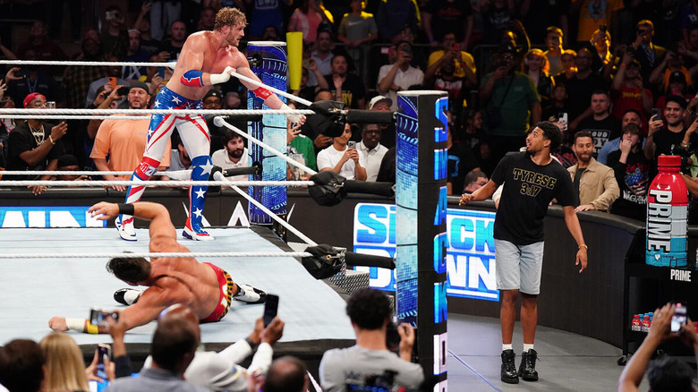 Logan Paul beckons a ringside Tyrese Haliburton.