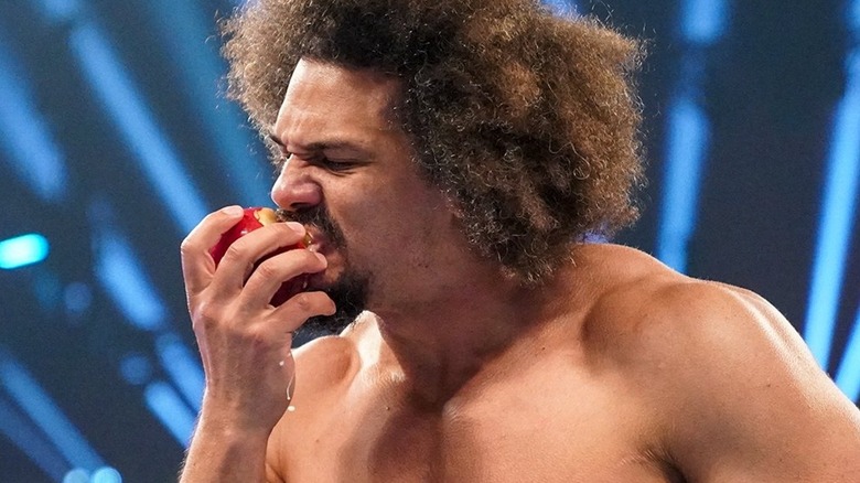 Carlito taking a bite of his apple