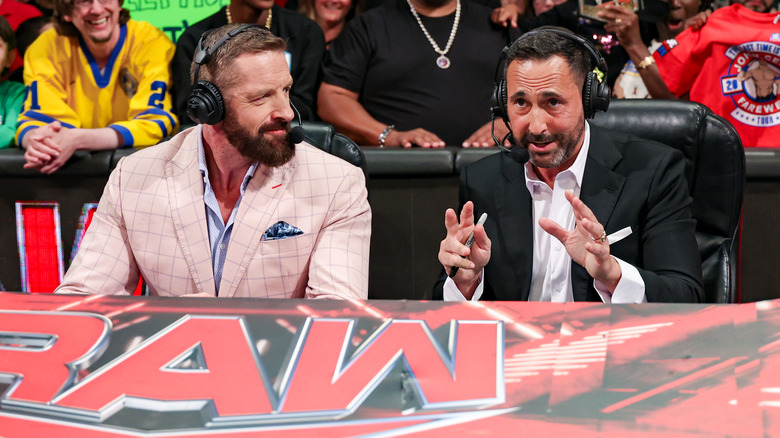 Wade Barrett and Joe Tessitore sitting at "WWE Raw" announce desk