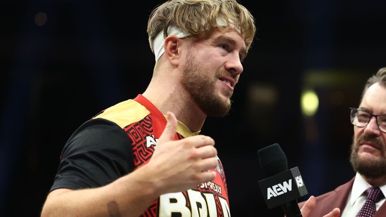 Will Ospreay talking into a microphone