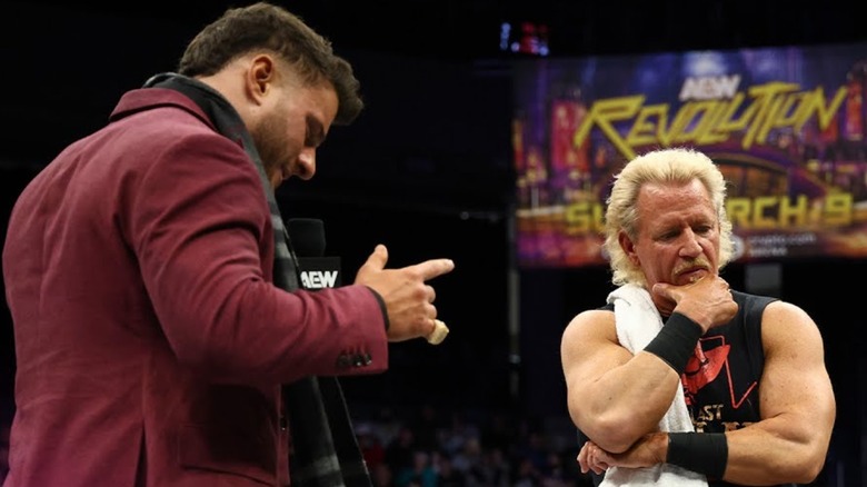 MJF holding a microphone in front of Jeff Jarrett