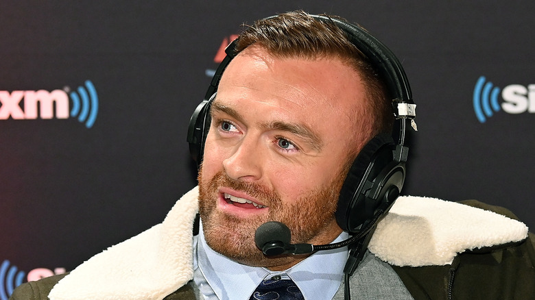 Nick Aldis wearing a headset