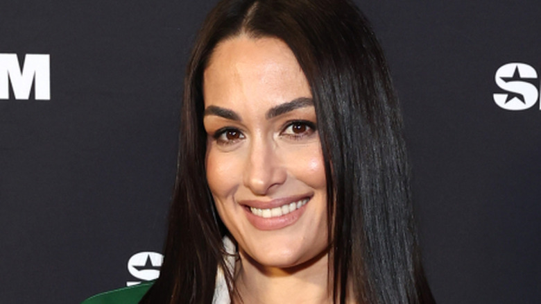 Nikki bella smiling at press event