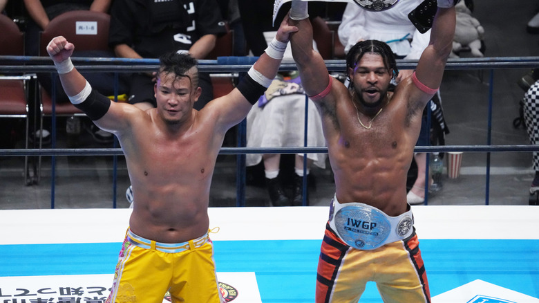 Kevin Knight and KUSHIDA celebrating