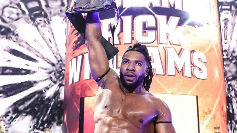 Trick Williams holding up the NXT Championship