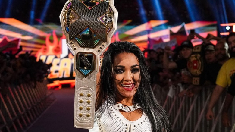 NXT Women's Champion Roxanne Perez holds up her title after defeating Lola Vice during "NXT" Heatwave.