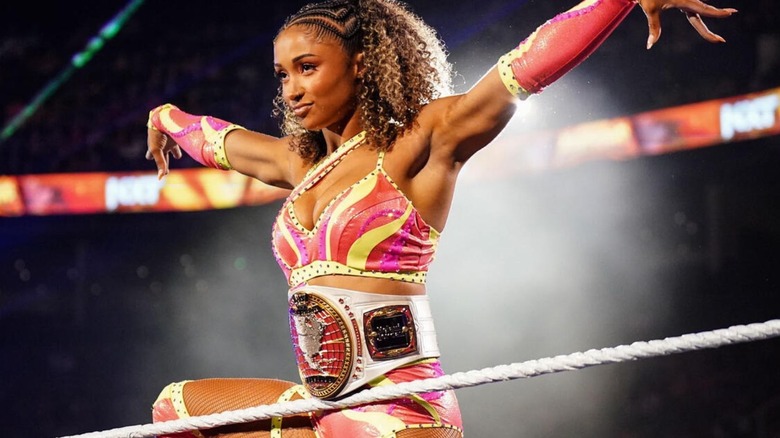 Kelani Jordan poses on the ropes wearing the Women's North American Championship before a match on "WWE NXT."