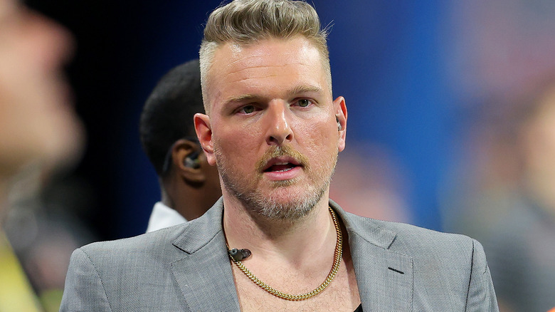 Pat McAfee wearing a gray suit