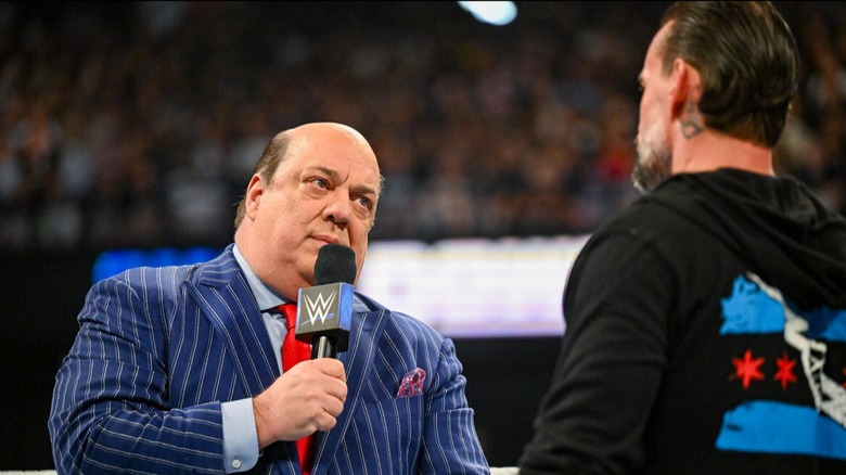 Paul Heyman steps in the ring and speaks to CM Punk on 