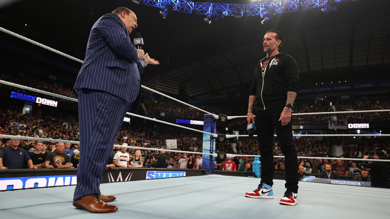 Paul Heyman talking to CM Punk in the ring on "WWE SmackDown"