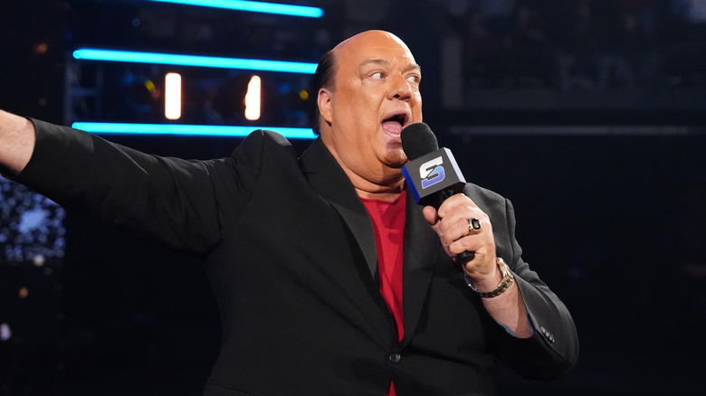 Paul Heyman pointing to SmackDown stage