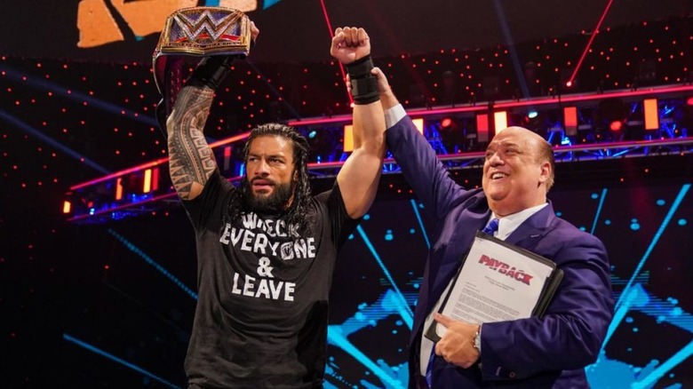 Roman Reigns and Paul Heyman celebrating