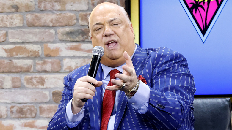 Paul Heyman holding a microphone