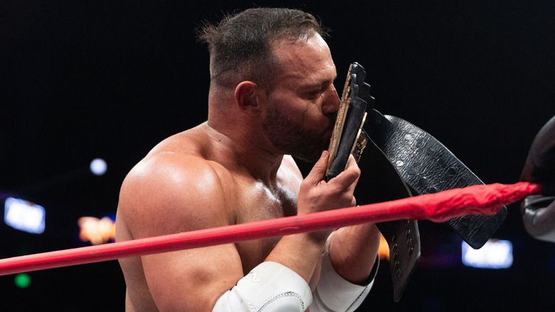 QT Marshall kisses his title belt