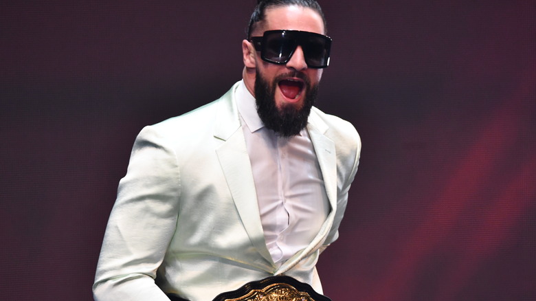 Seth Rollins sunglasses smiliing