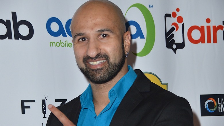 Shawn Daivari pointing and smiling