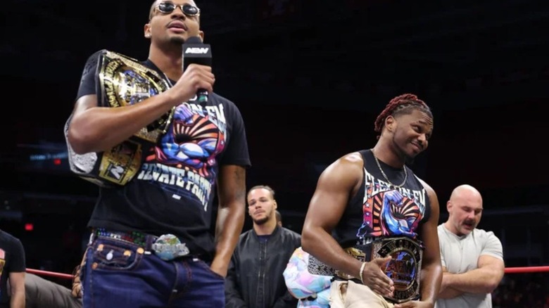 Private Party's Zay and Quen hold their tag team championships in the ring and cut a promo on AEW television.