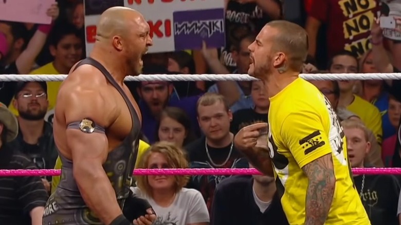 CM Punk and Ryback arguing in the ring
