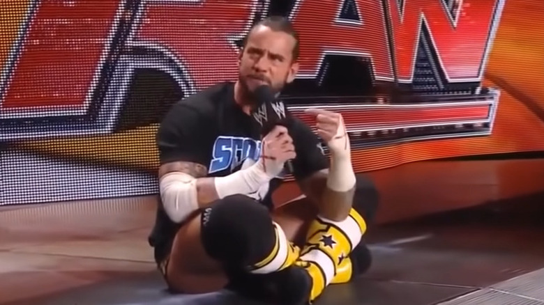 Punk sitting cross legged