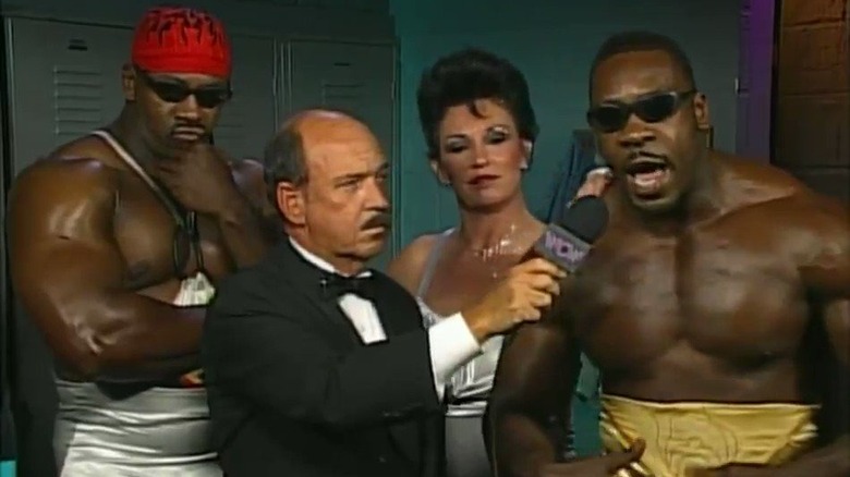 Booker cutting his promo backstage with Harlem Heat