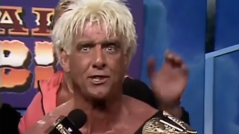 Flair cutting his post-match promo backstage