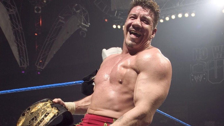 World Heavyweight Champion Eddie Guerrero smiles for the camera and the crowd as he enters the ring during an episode of WWE TV.