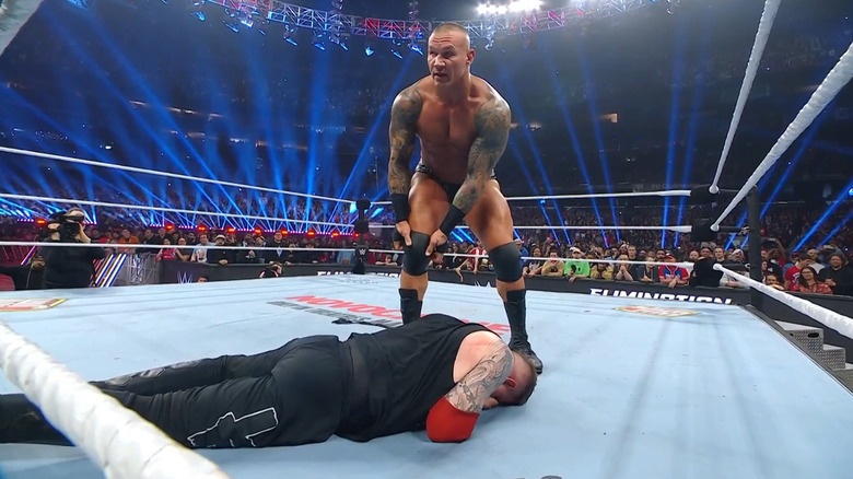 Randy Orton sets up for the punt kick to Kevin Owens