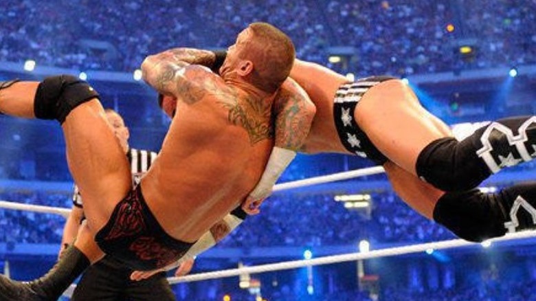 Randy Orton hitting CM Punk with a mid-air RKO at WrestleMania 27