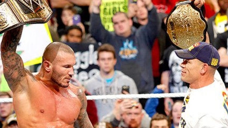 Randy Orton and John Cena hold titles