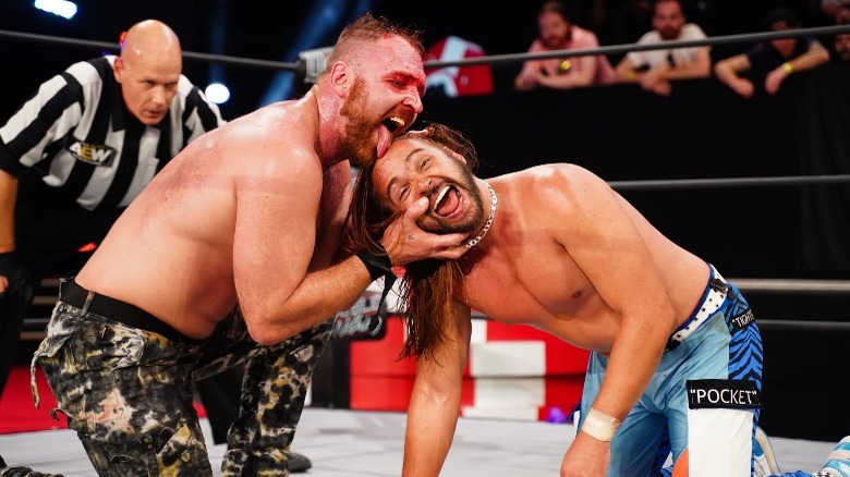 Jon Moxley licking Nick Jackson