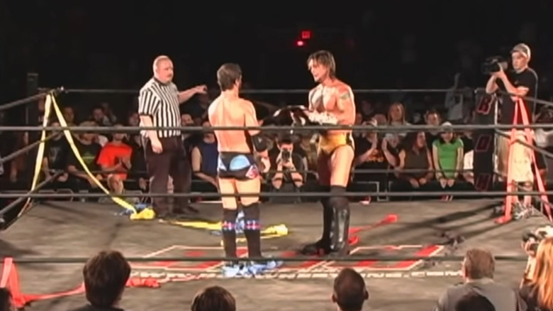 Austin Aries hands CM Punk ROH Title