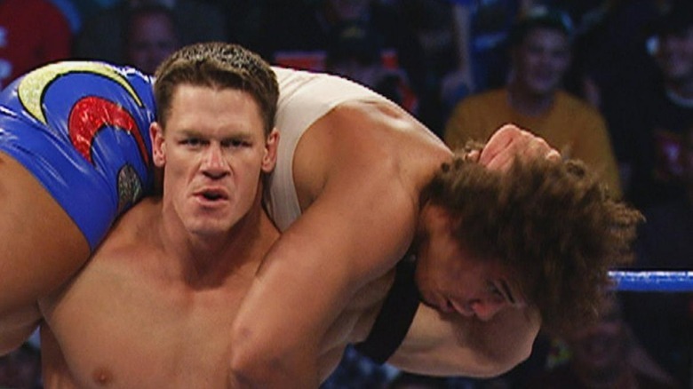 John Cena with Carlito in a Fireman's Carry