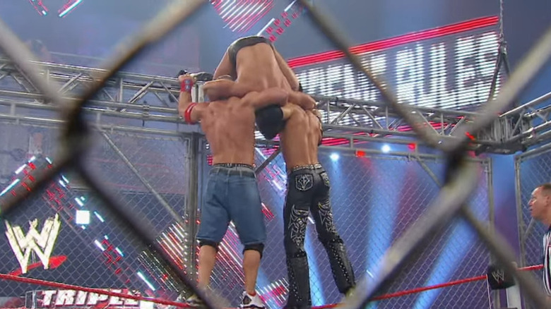 John Cena and John Morrison grabbing the Miz