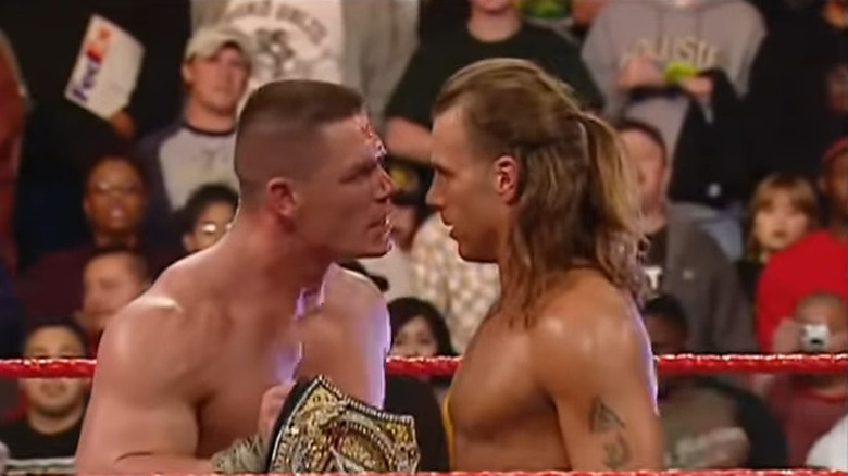 John Cena and Shawn Michaels staring down