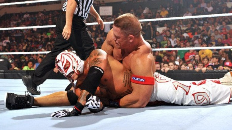 John Cena and Rey Mysterio grappling