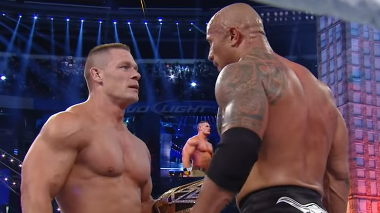 John Cena and the Rock staring down